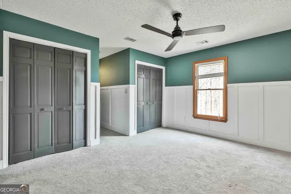 a view of room with wooden floor