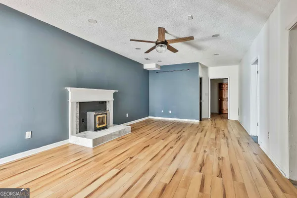 a view of backyard with large trees