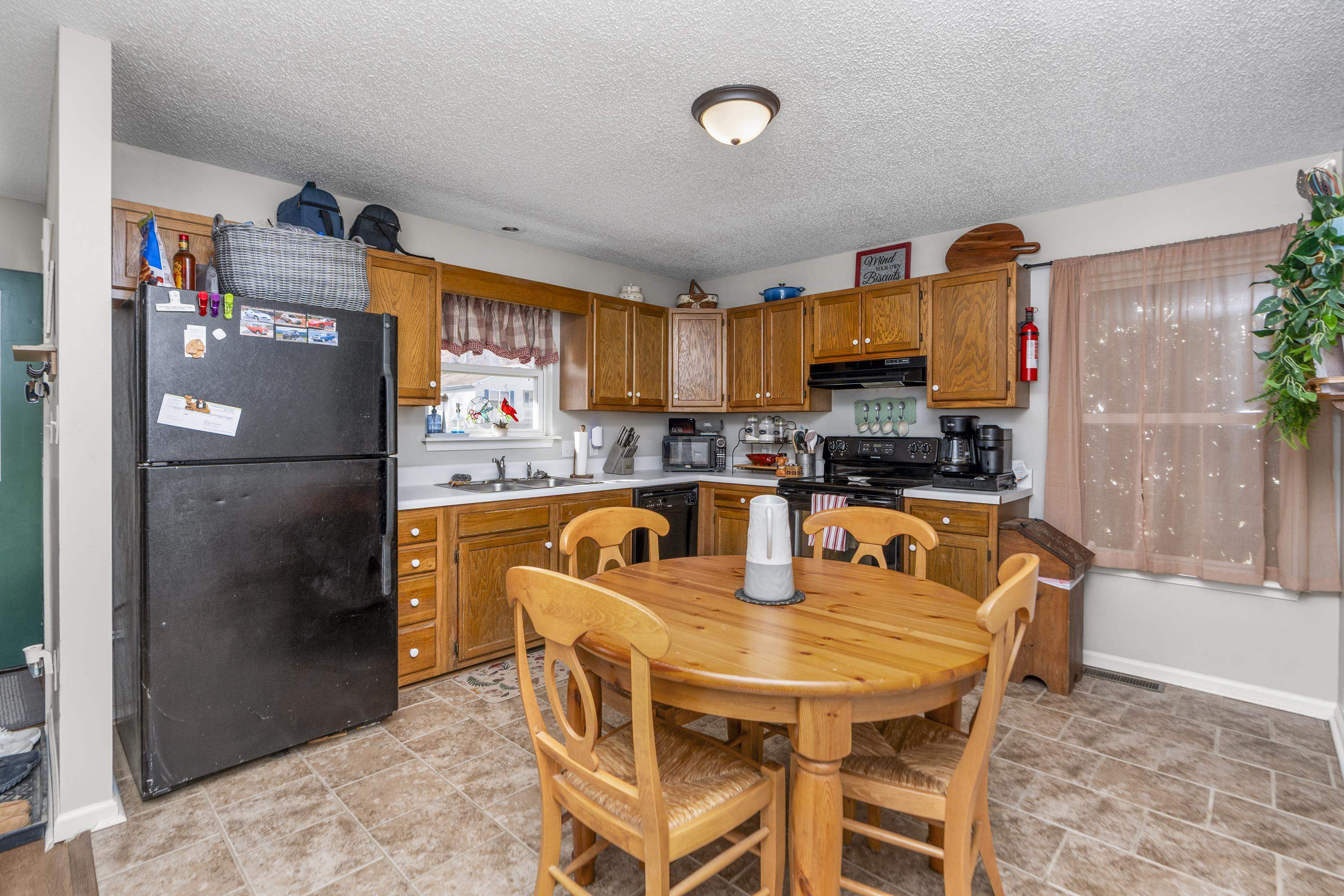 1625 D Street Waynesboro, VA 22980 - Photo 11 of 33 a dining table chair next to a window