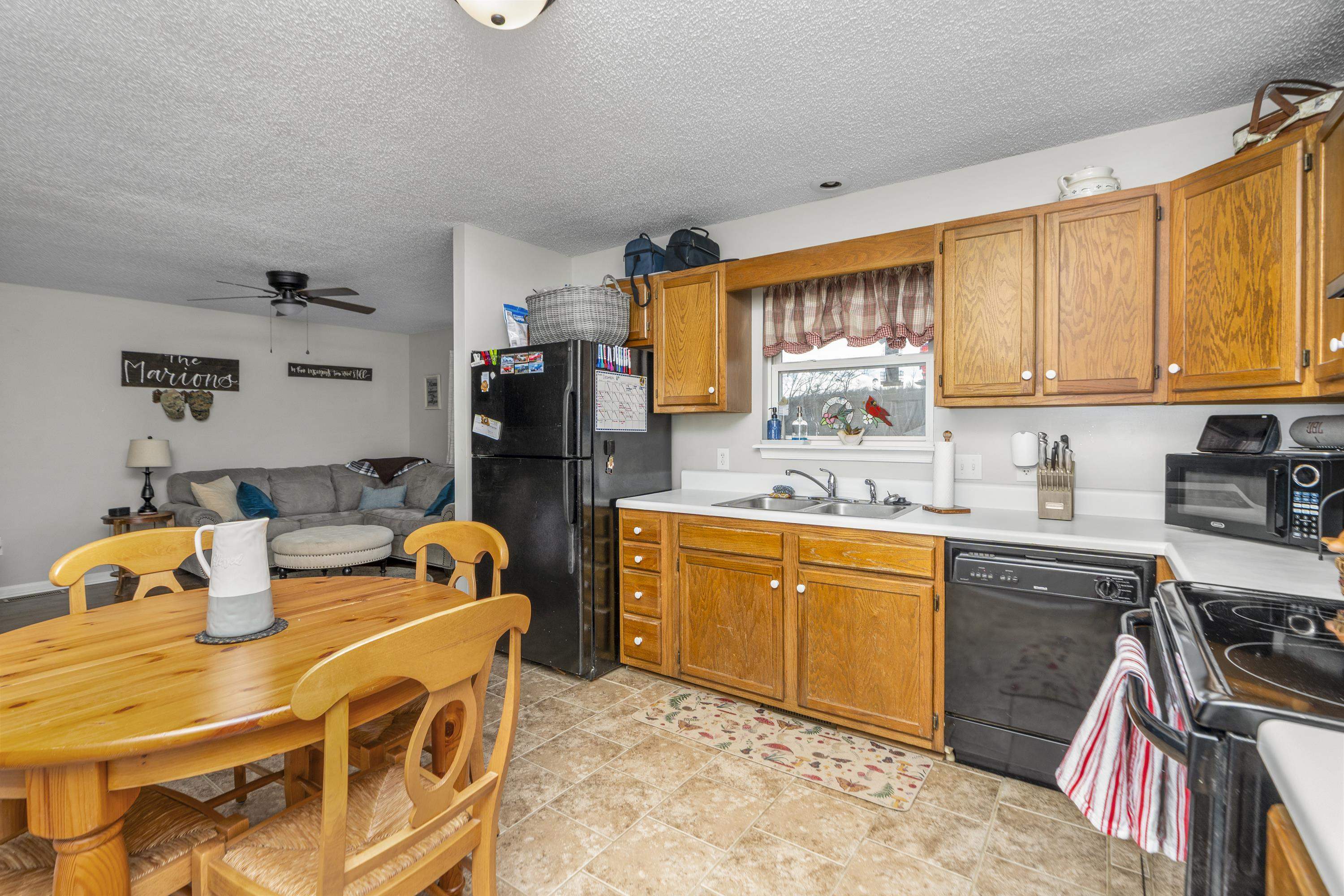 1625 D Street Waynesboro, VA 22980 - Photo 13 of 33 a kitchen with stainless steel appliances granite countertop a sink stove and refrigerator