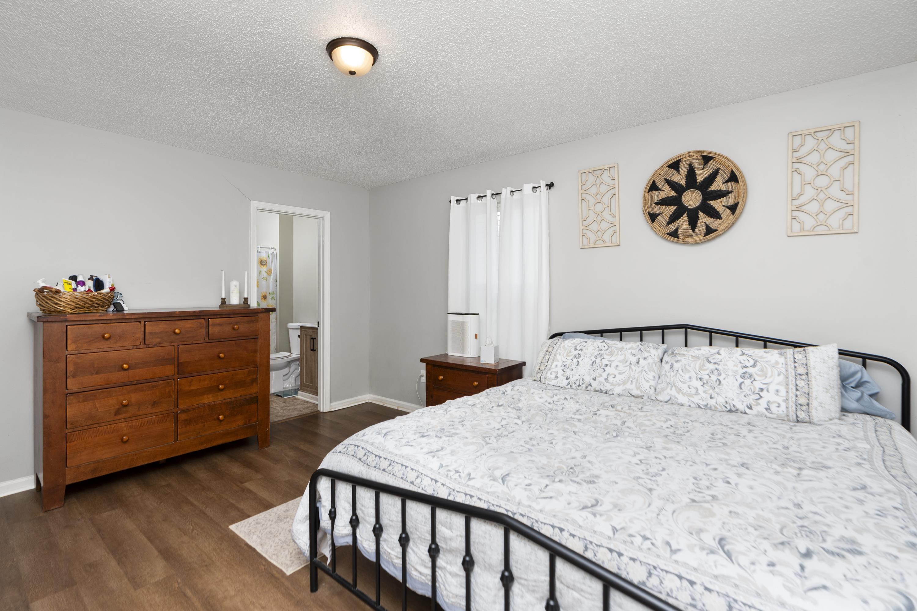 1625 D Street Waynesboro, VA 22980 - Photo 18 of 33 a bedroom with a bed and a dresser in it
