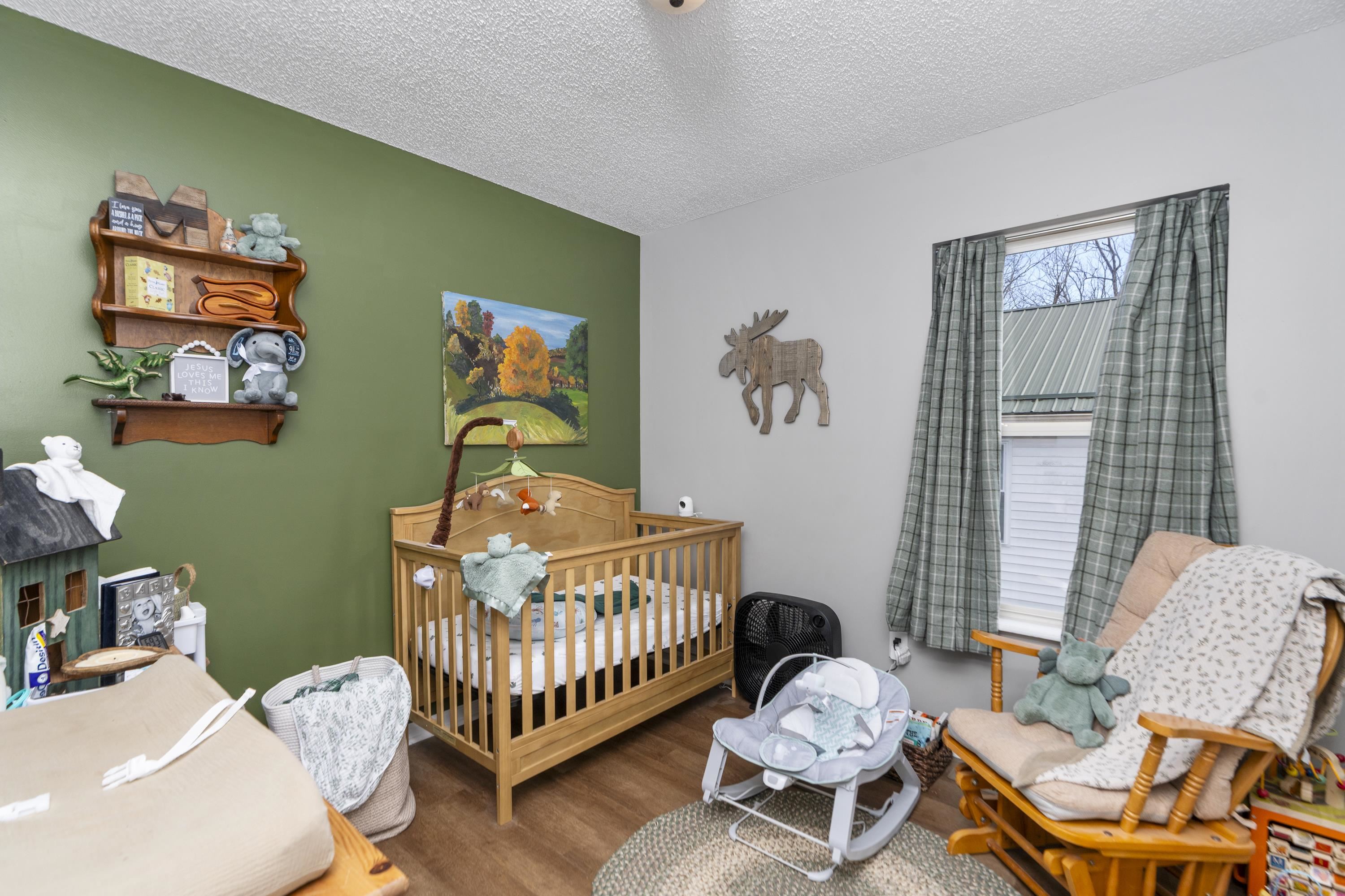 1625 D Street Waynesboro, VA 22980 - Photo 20 of 33 a bedroom with a bed and wooden floor