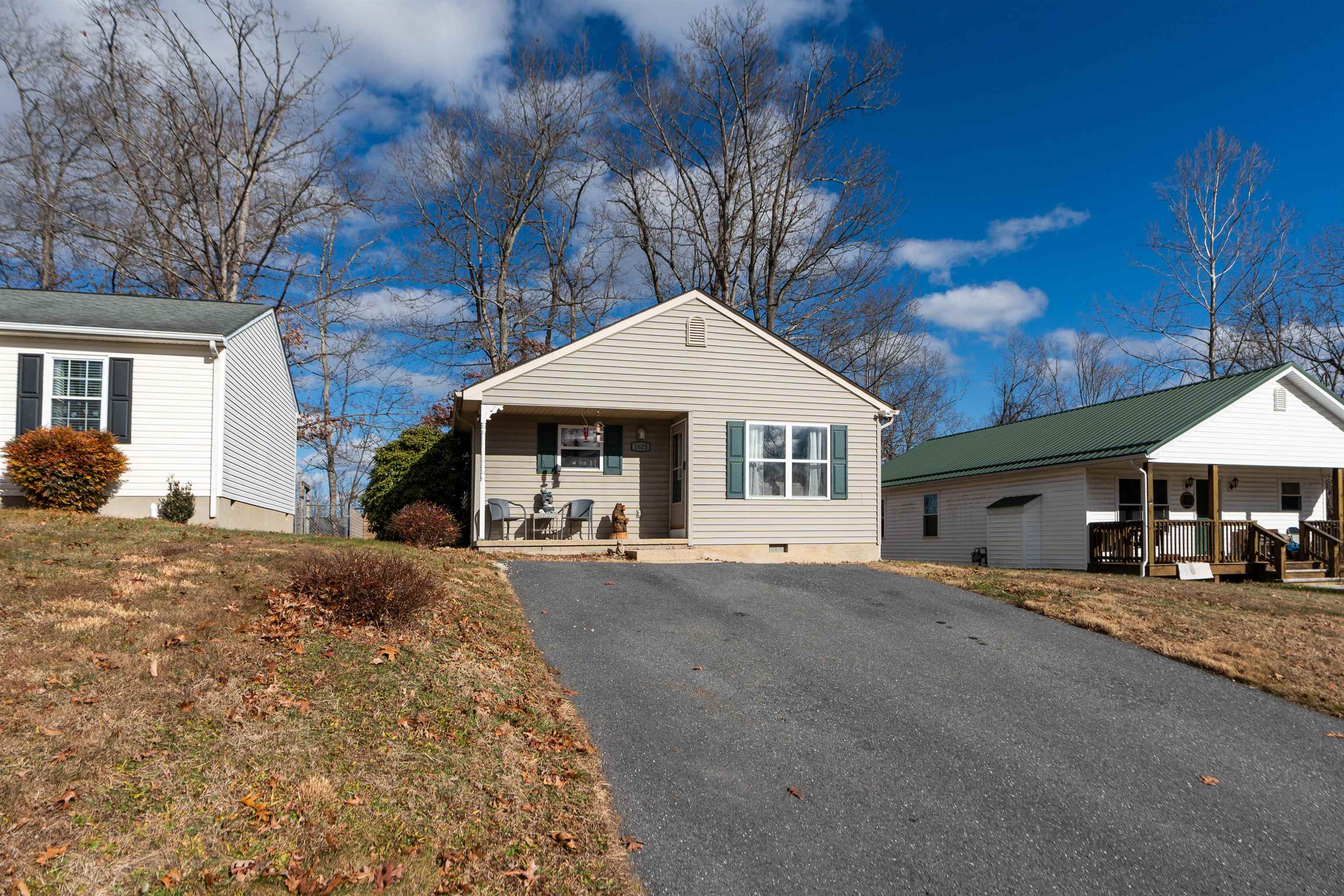 1625 D Street Waynesboro, VA 22980 - Photo 2 of 33 a front view of a house with a yard and garage