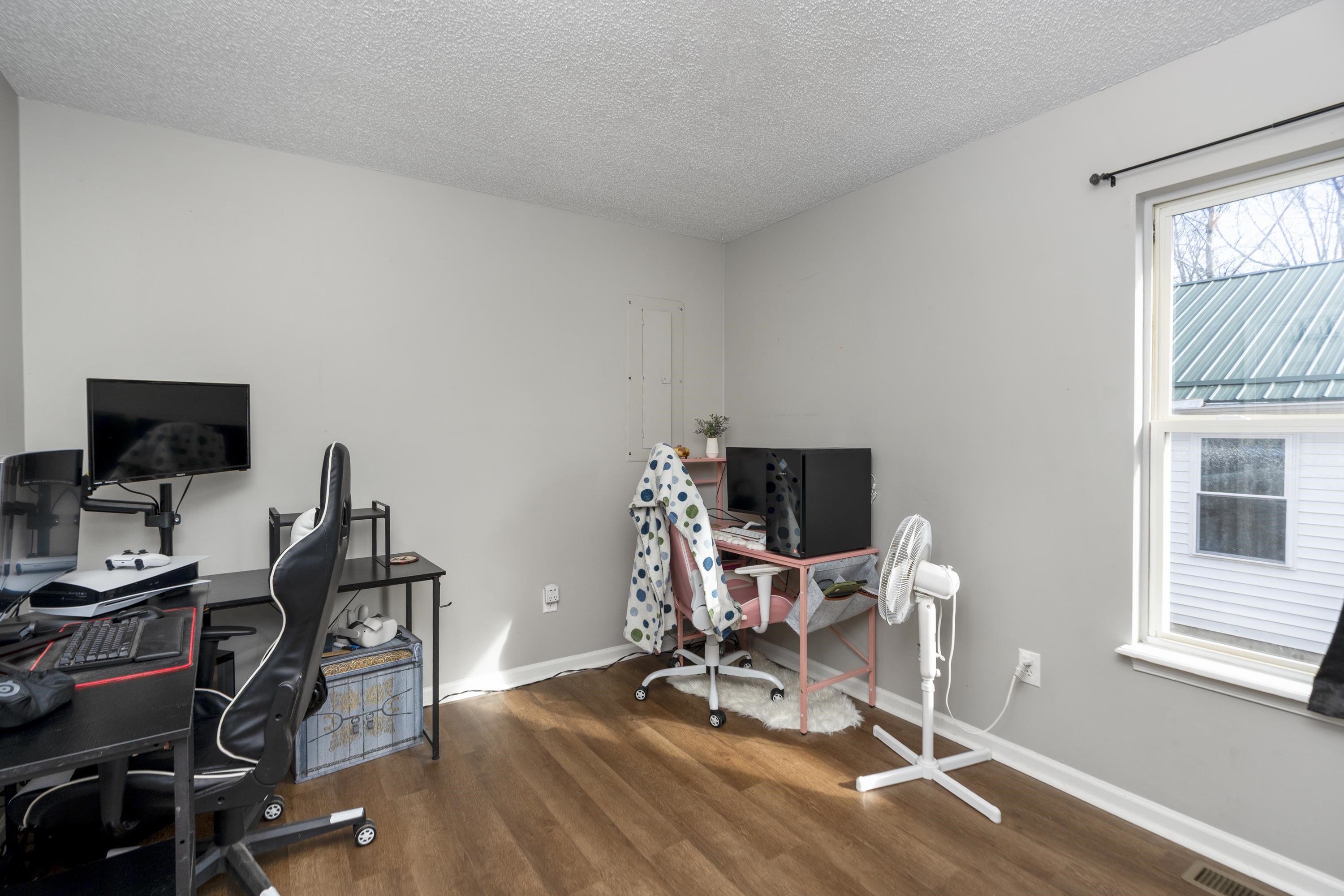 1625 D Street Waynesboro, VA 22980 - Photo 24 of 33 a view of a workspace with furniture and a window