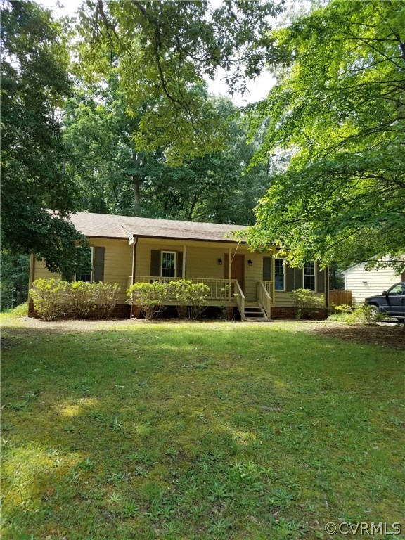 7835 Brightridge Road Chesterfield, VA 23832 - Photo 1 of 18 a front view of a house with a garden
