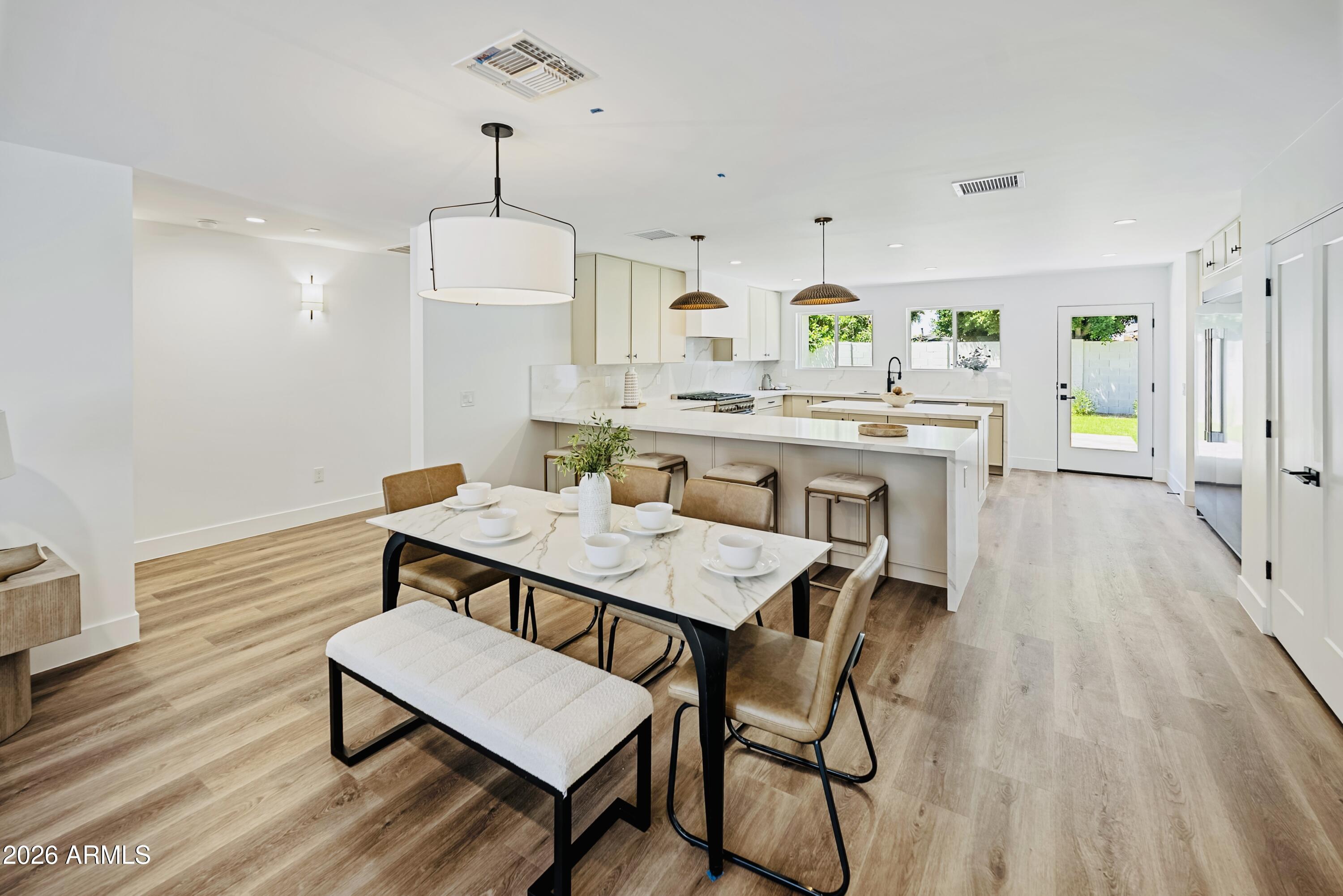 6830 North 10th Place Phoenix, AZ 85014 - Photo 8 of 38 Dining Opening up t the Large Kitchen