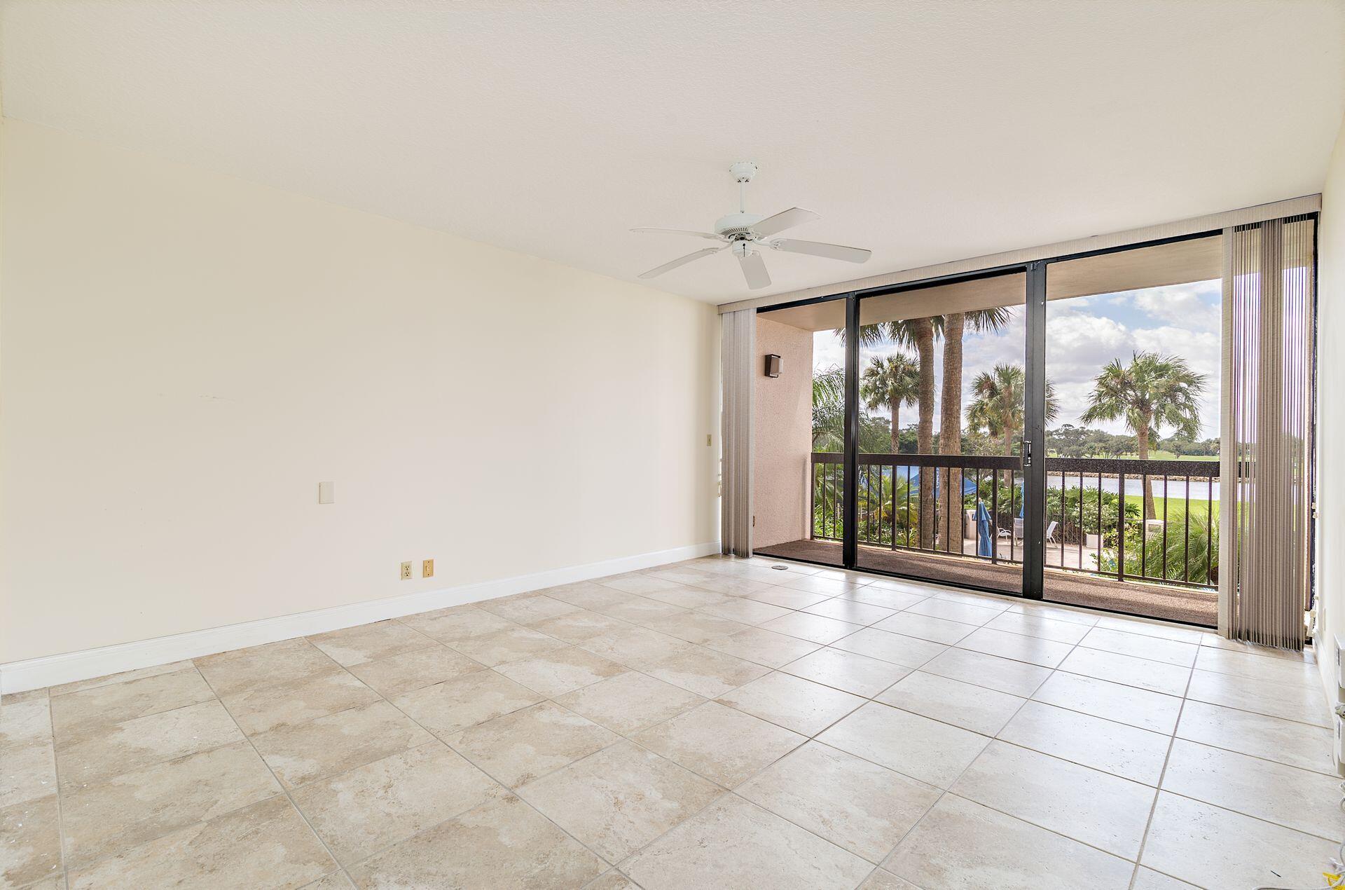 356 Golfview Road, Unit 204 North Palm Beach, FL 33408 - Photo 18 of 71 a view of an empty room with a balcony