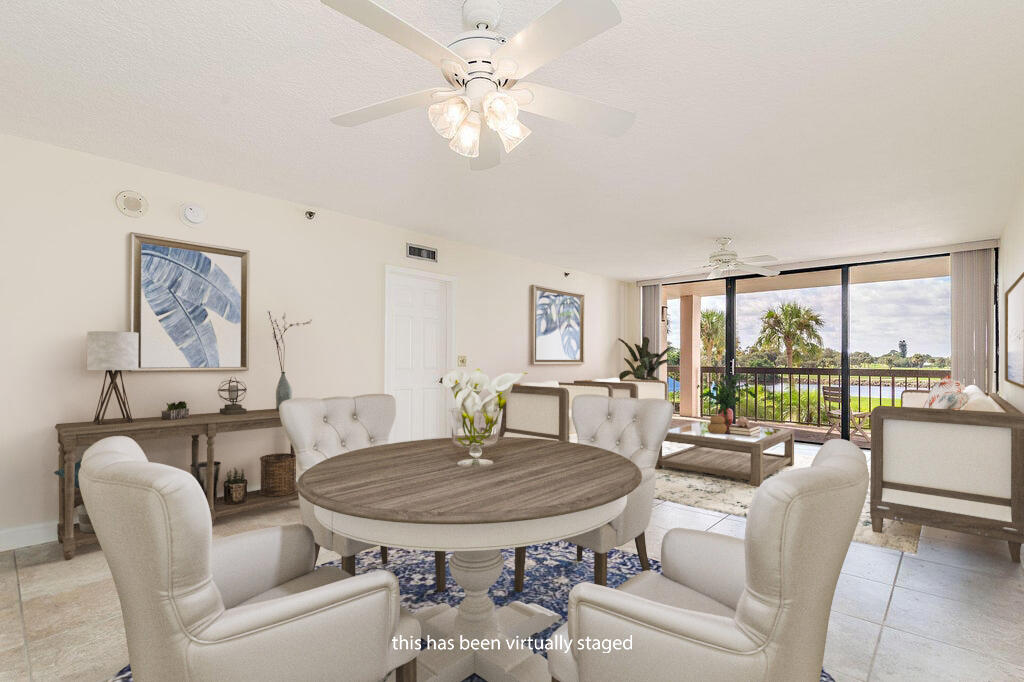 356 Golfview Road, Unit 204 North Palm Beach, FL 33408 - Photo 5 of 71 a view of a dining room with furniture window and outside view