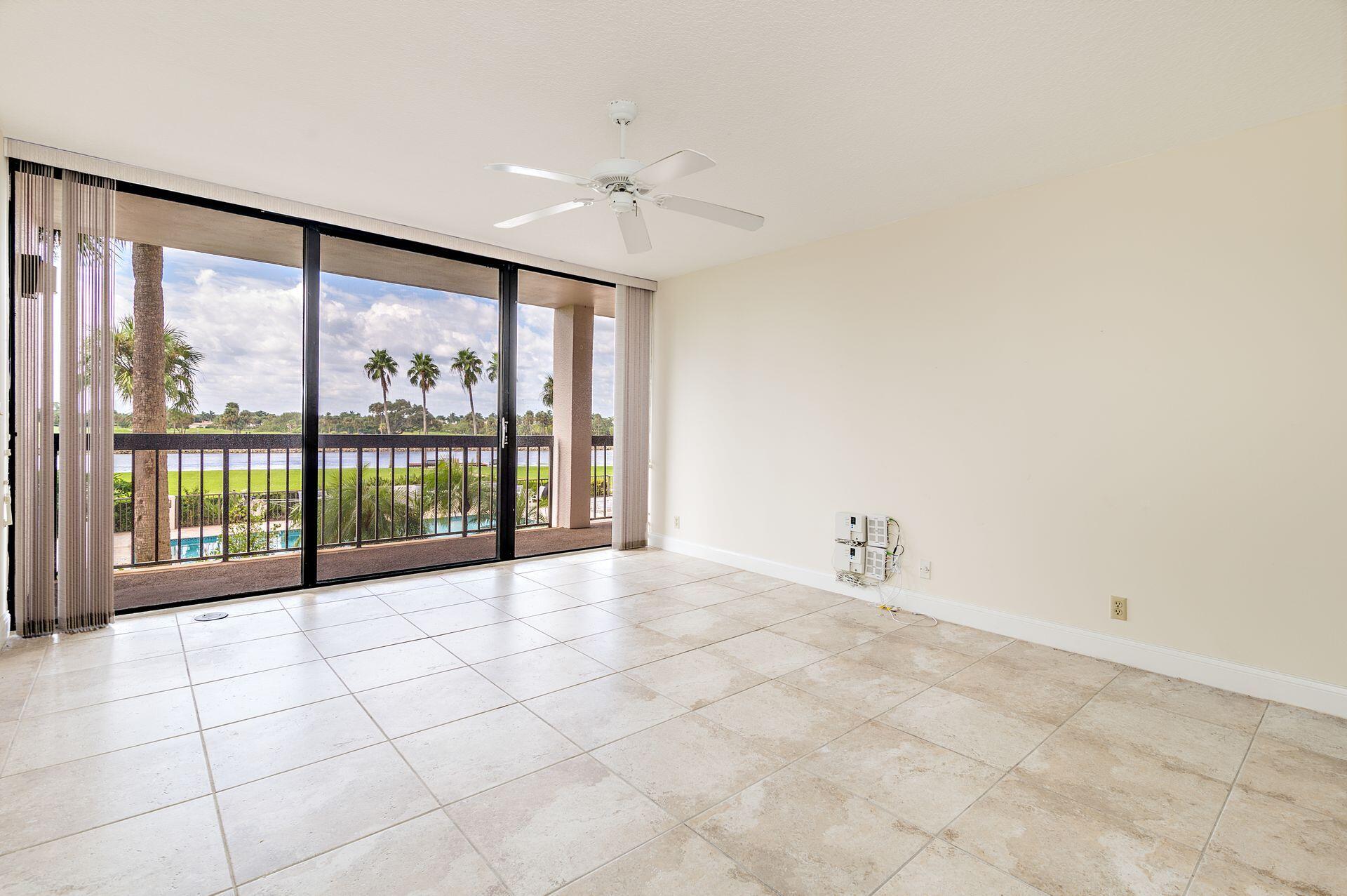 356 Golfview Road, Unit 204 North Palm Beach, FL 33408 - Photo 51 of 71 a view of an empty room with a balcony