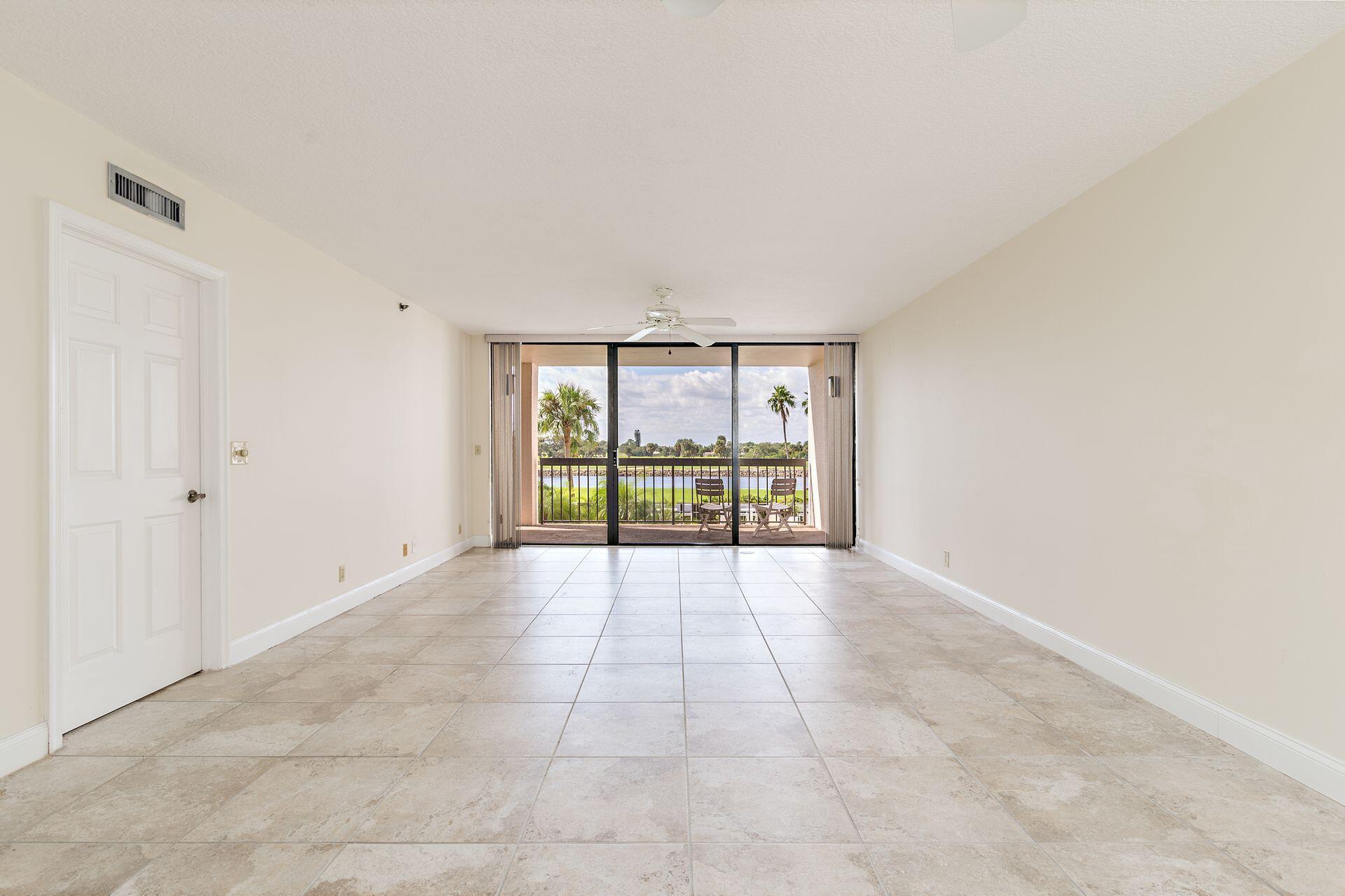356 Golfview Road, Unit 204 North Palm Beach, FL 33408 - Photo 10 of 71 a view of an empty room with a window
