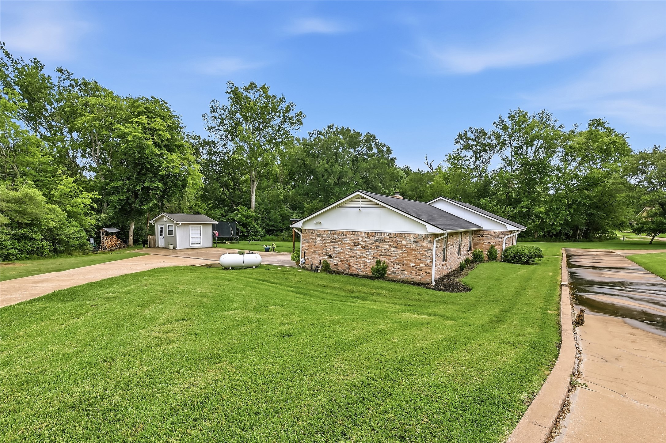 906 Standley Road Madisonville, TX 77864 - Photo 29 of 40 a view of a house with backyard and garden