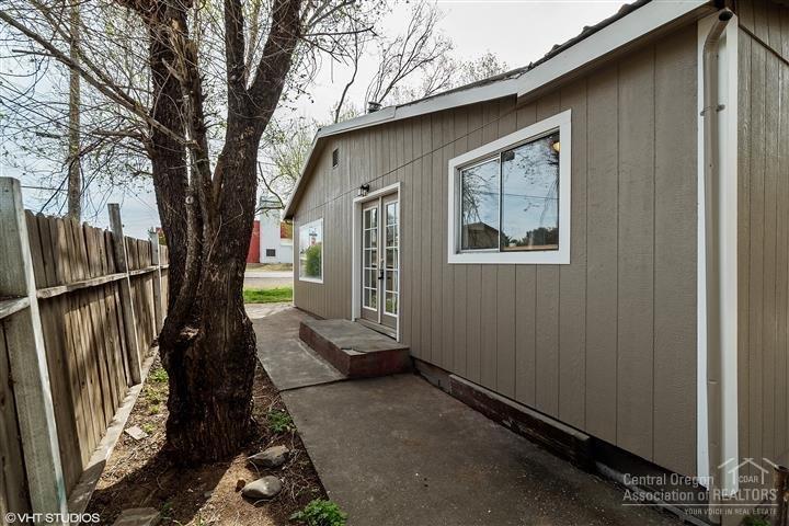 756 Southwest 3rd Street Madras, OR 97741 - Photo 22 of 24 Right side of home with French doors lea