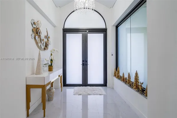 a view of an entryway with a chandelier