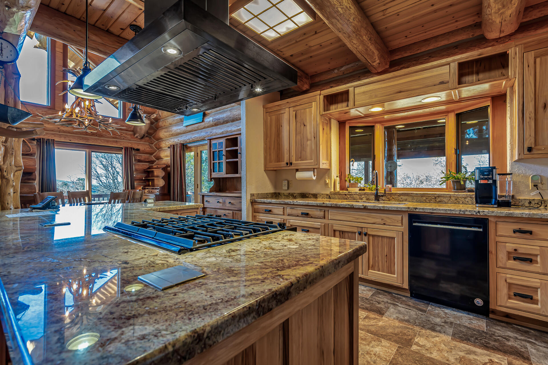 43007 Shoshoni Loop Fall River Mills, CA 96028 - Photo 38 of 87 a kitchen with stainless steel appliances granite countertop a stove a sink and a wooden cabinets