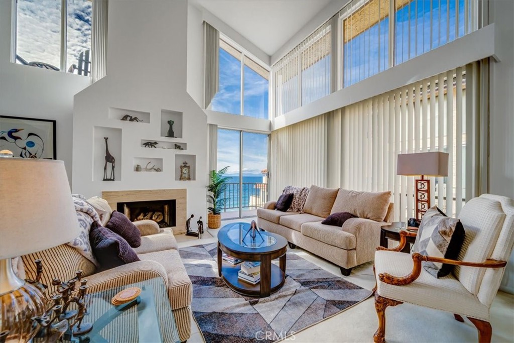 555 Esplanade, Unit 518 Redondo Beach, CA 90277 - Photo 17 of 73 a living room with furniture and a fireplace