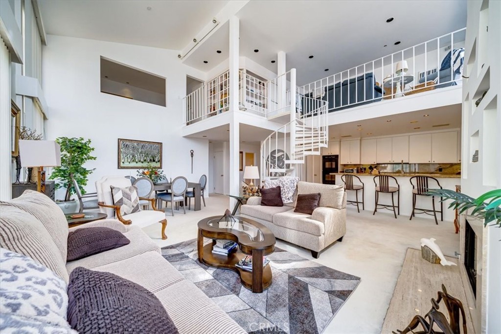 555 Esplanade, Unit 518 Redondo Beach, CA 90277 - Photo 18 of 73 a living room with furniture kitchen view and a large window