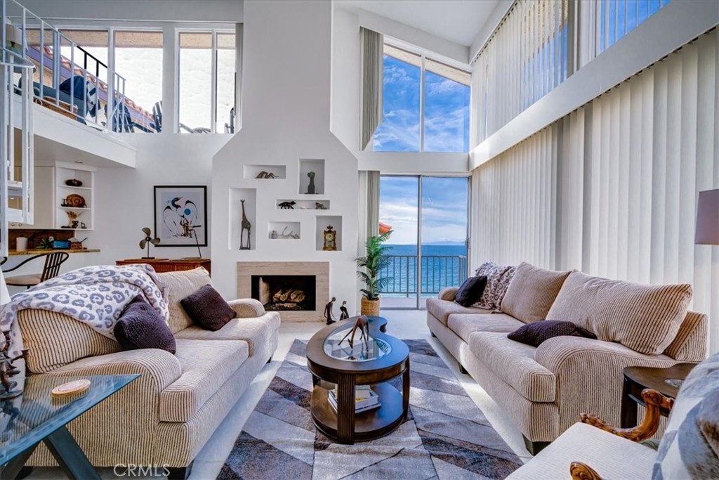 555 Esplanade, Unit 518 Redondo Beach, CA 90277 - Photo 19 of 73 a living room with furniture fireplace and window