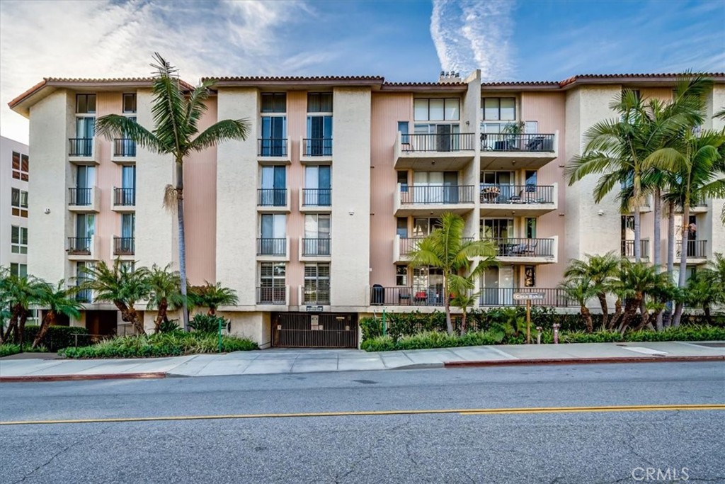 555 Esplanade, Unit 518 Redondo Beach, CA 90277 - Photo 25 of 73 a front view of multiple houses with yard