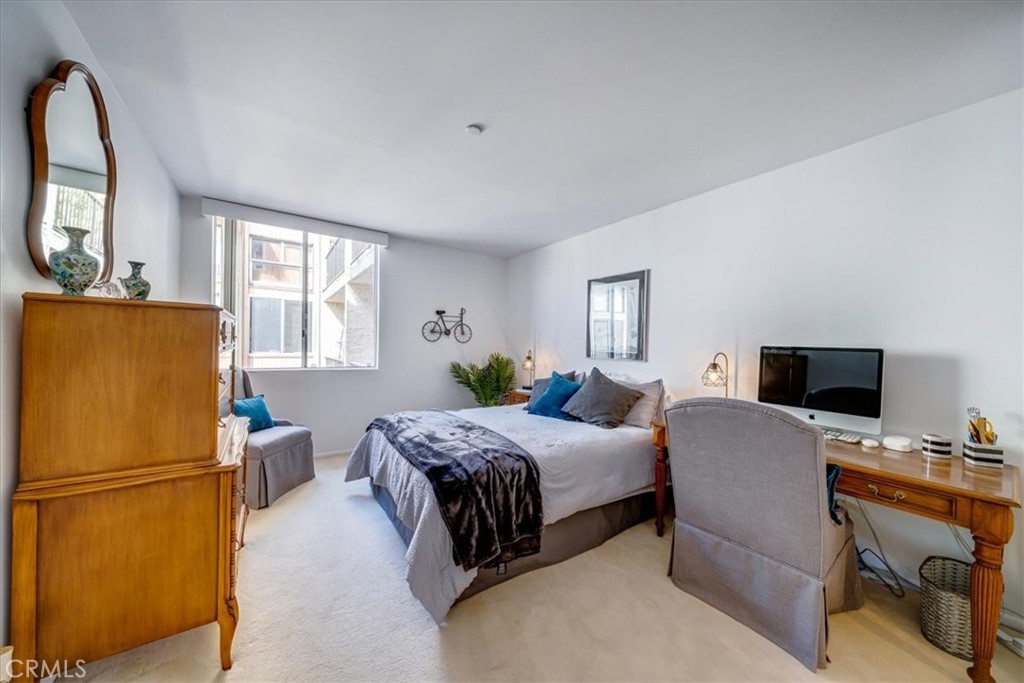 555 Esplanade, Unit 518 Redondo Beach, CA 90277 - Photo 28 of 73 a bedroom with a bed and a window