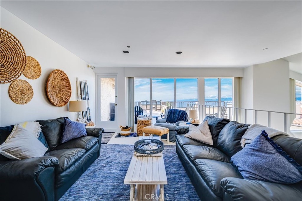555 Esplanade, Unit 518 Redondo Beach, CA 90277 - Photo 32 of 73 a living room with furniture kitchen view and a large window