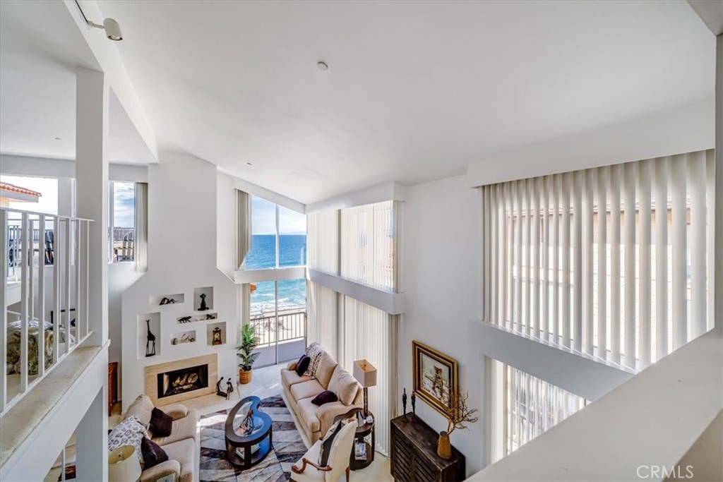 555 Esplanade, Unit 518 Redondo Beach, CA 90277 - Photo 36 of 73 a living room with furniture fireplace and a window