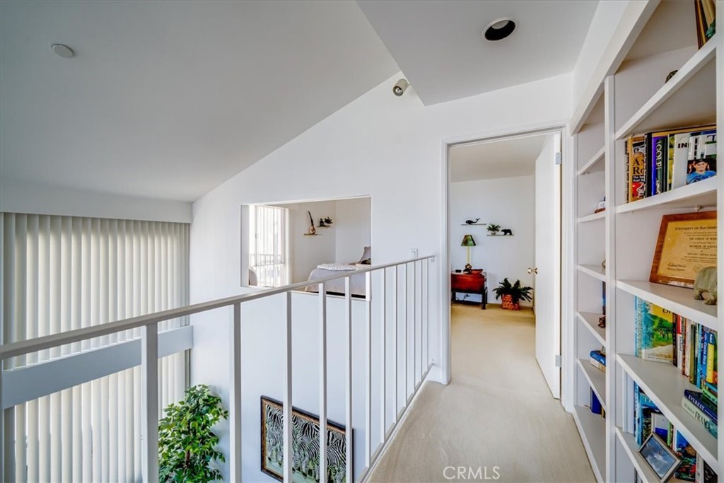 555 Esplanade, Unit 518 Redondo Beach, CA 90277 - Photo 37 of 73 a view of a bedroom with baby crib and baby crib
