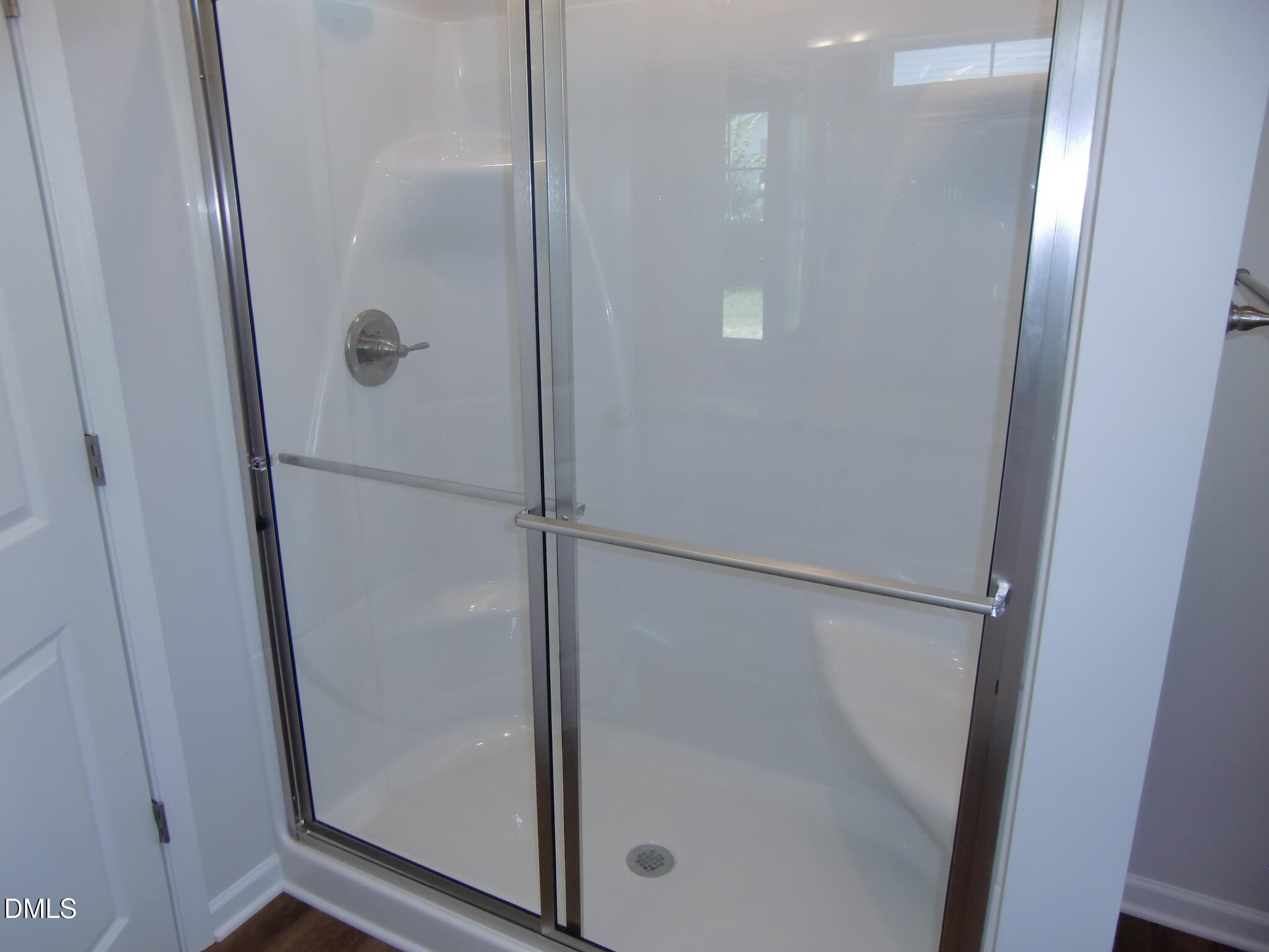 100 Covington Lane Dunn, NC 28334 - Photo 49 of 61 a bathroom with a glass shower door