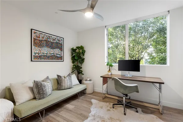 a bedroom with a bed and a mirror