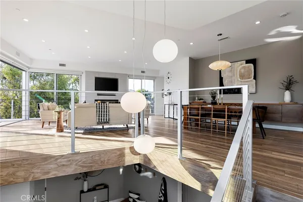 a living room with furniture tv and a large window