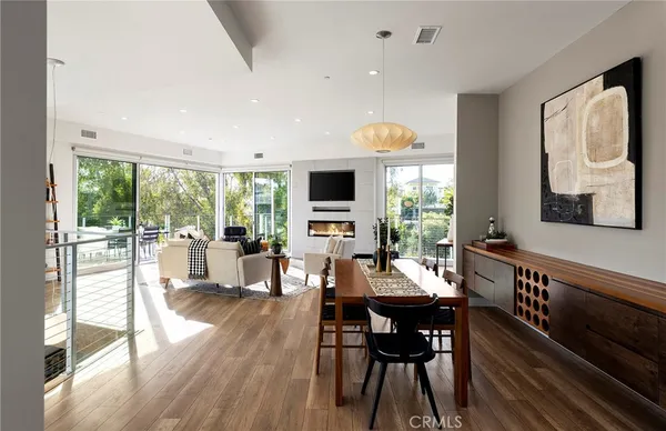 a view of a patio with table and chairs and potted plants
