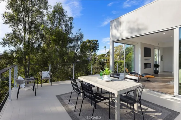 a kitchen with stainless steel appliances a sink a stove a refrigerator and cabinets