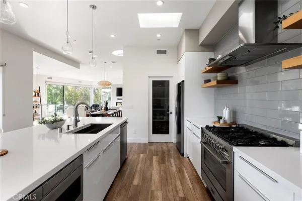 an aerial view of a house with a mountain view