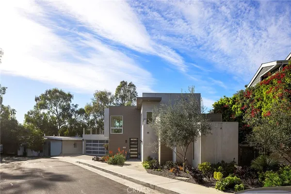 a bathroom with a double vanity sink mirror and toilet