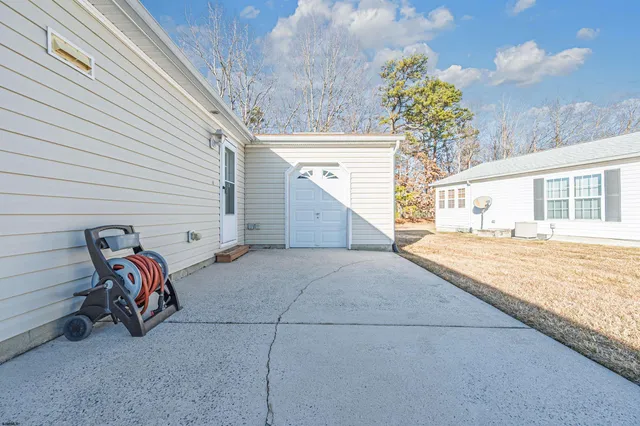 a view of a two chairs in the balcony