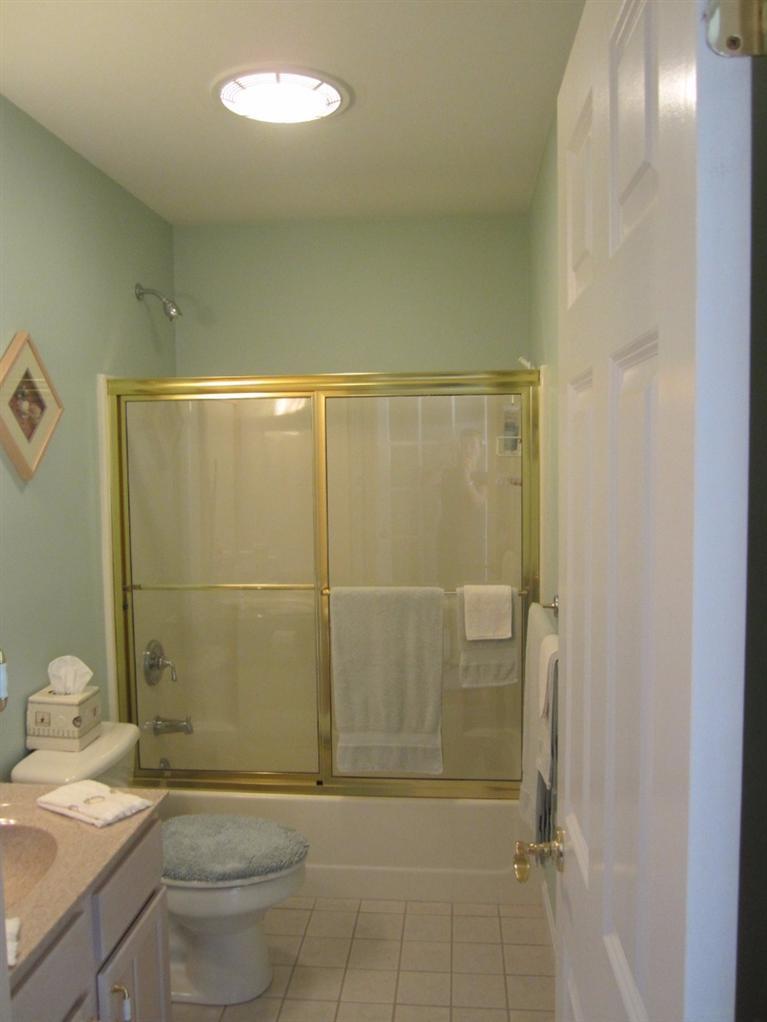 10 Captain Kidd Road East Sandwich, MA 02537 - Photo 14 of 31 a bathroom with a granite countertop sink a toilet and shower