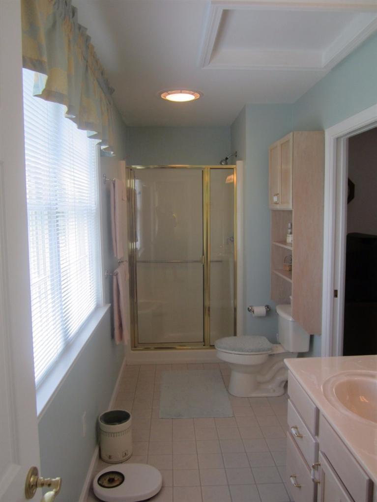 10 Captain Kidd Road East Sandwich, MA 02537 - Photo 18 of 31 a bathroom with a sink a toilet and shower