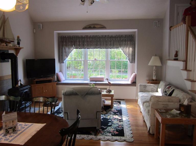 10 Captain Kidd Road East Sandwich, MA 02537 - Photo 10 of 31 a living room with furniture and a flat screen tv