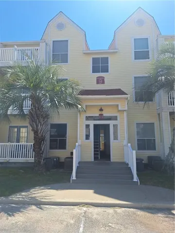 a front view of a house with garage