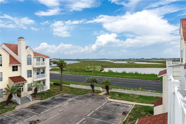 a view of an ocean with a big house