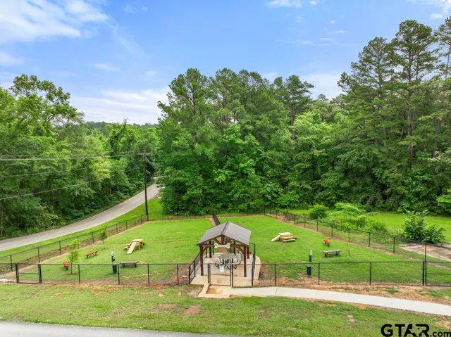 a view of a lake with houses in the back