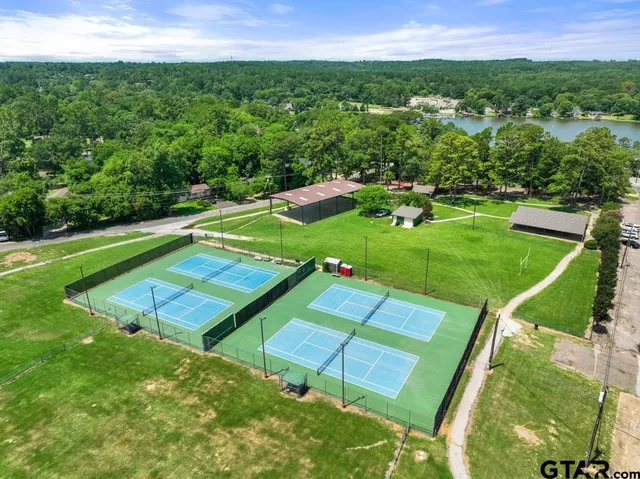 a view of a lake with a table and chairs