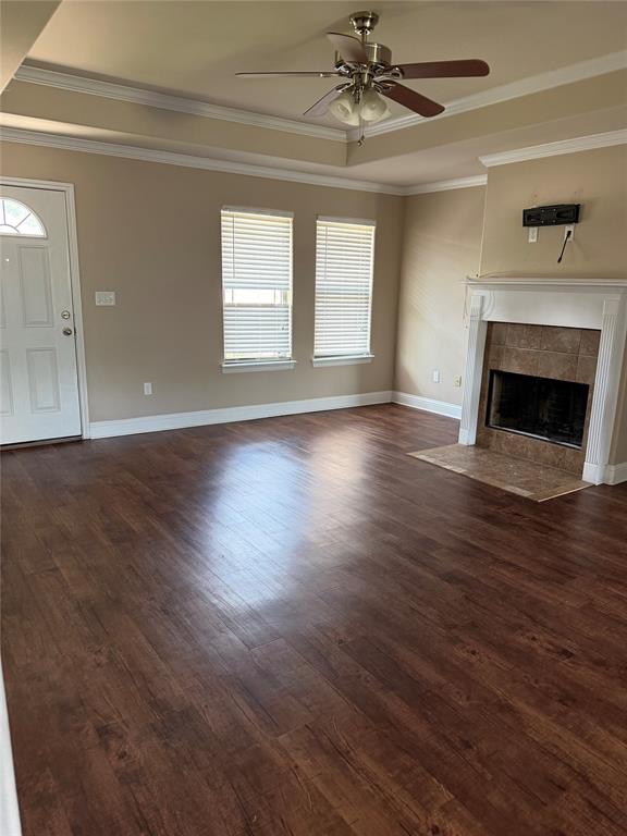 520 Big Red Circle Haughton, LA 71037 - Photo 4 of 25 Spacious living area featuring wood-finish flooring, a tray ceiling with crown molding, and a ceiling fan