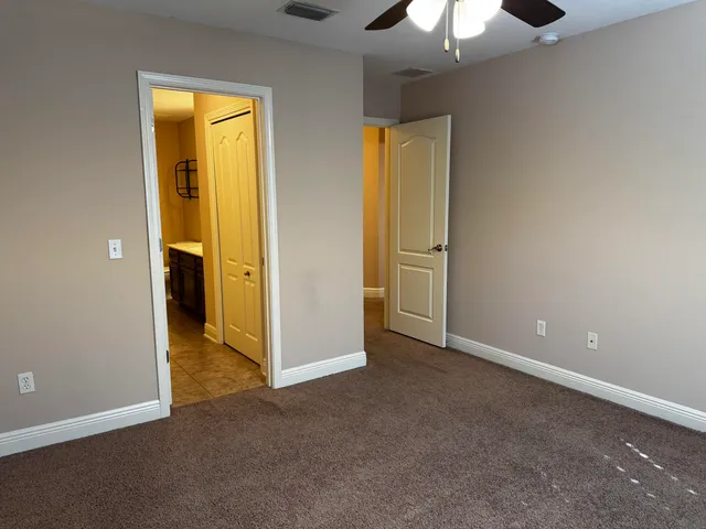 an empty room with a bathroom