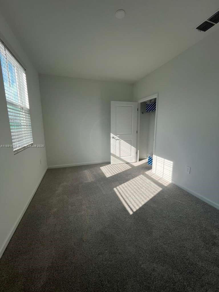 5984 Zen Way, Unit 5984 Clermont, FL 34714 - Photo 16 of 51 a view of an empty room and window