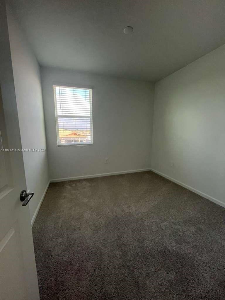 5984 Zen Way, Unit 5984 Clermont, FL 34714 - Photo 19 of 51 an empty room with a window