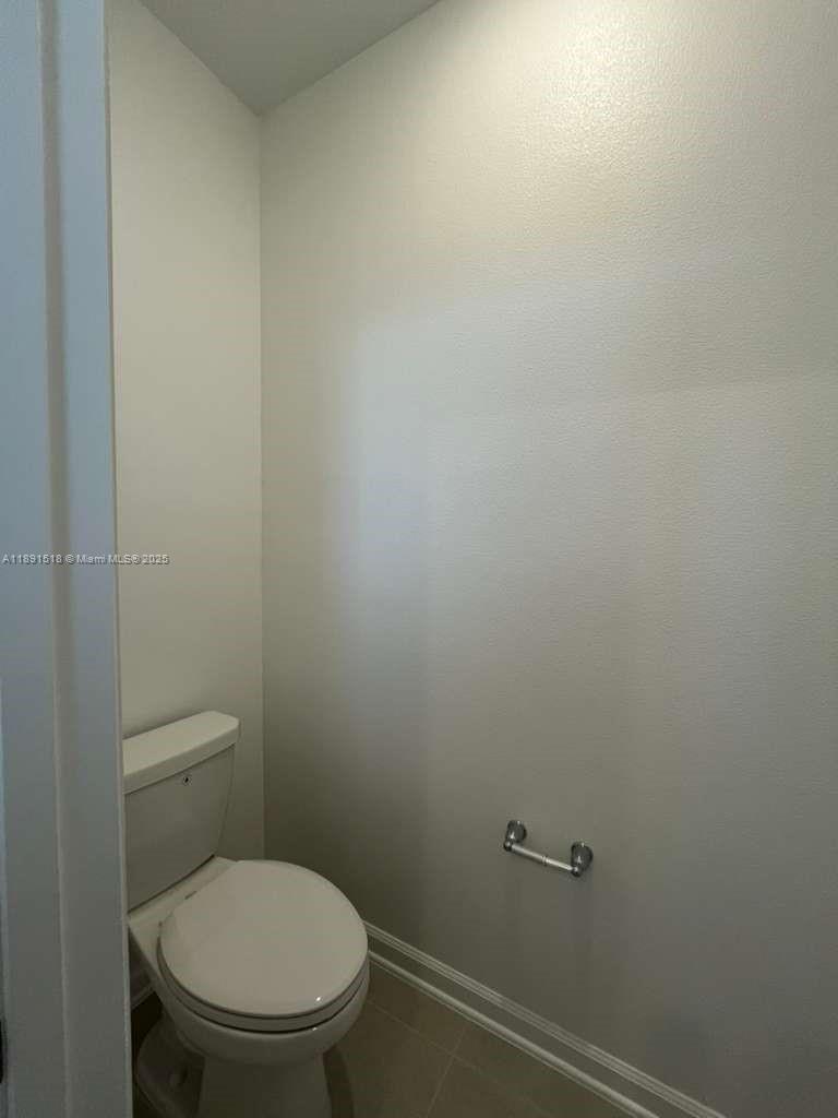 5984 Zen Way, Unit 5984 Clermont, FL 34714 - Photo 21 of 51 a white toilet sitting next to a white wall