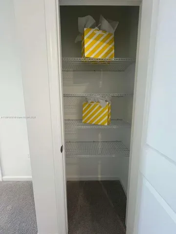 a bathroom with a shower and a glass door