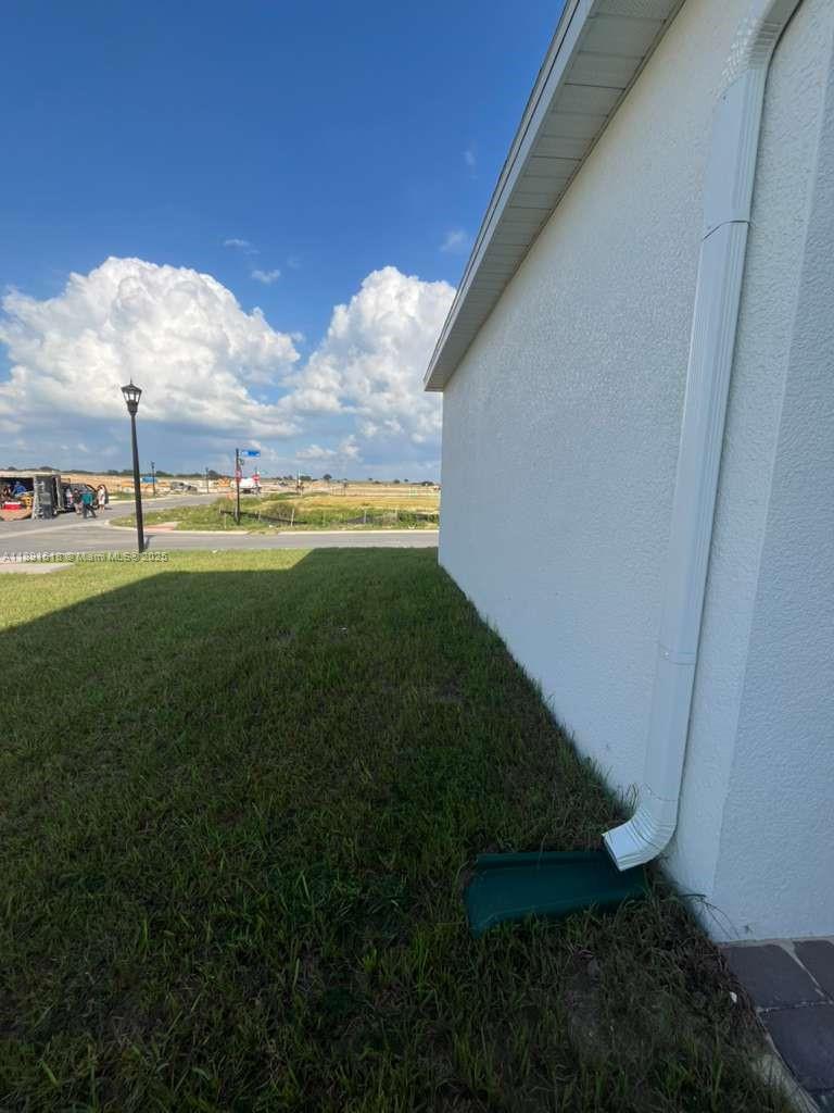 5984 Zen Way, Unit 5984 Clermont, FL 34714 - Photo 30 of 51 a view of an outdoor space and a yard