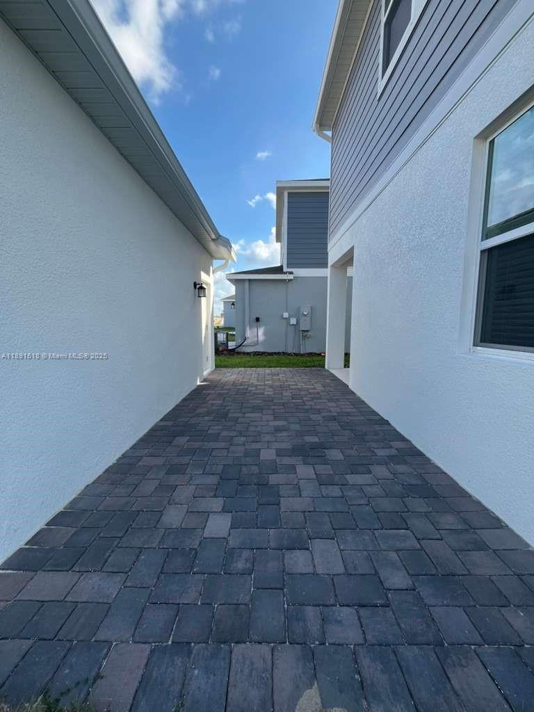 5984 Zen Way, Unit 5984 Clermont, FL 34714 - Photo 31 of 51 a view of a hallway with a kitchen