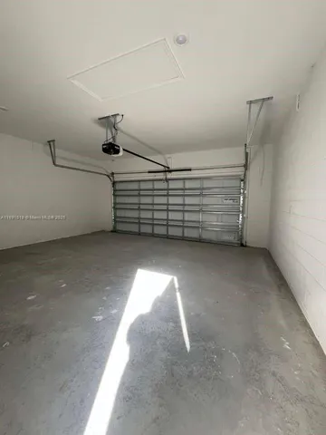 a view of a garden with a tree in the background